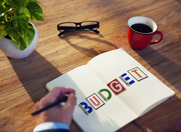 Businessman writing in notebook — Stock Photo, Image