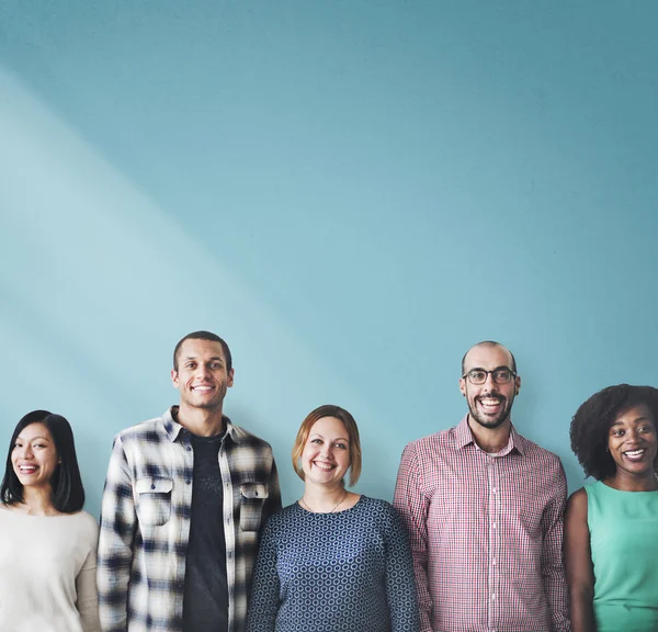 People stands near blue wall — Stock Photo, Image