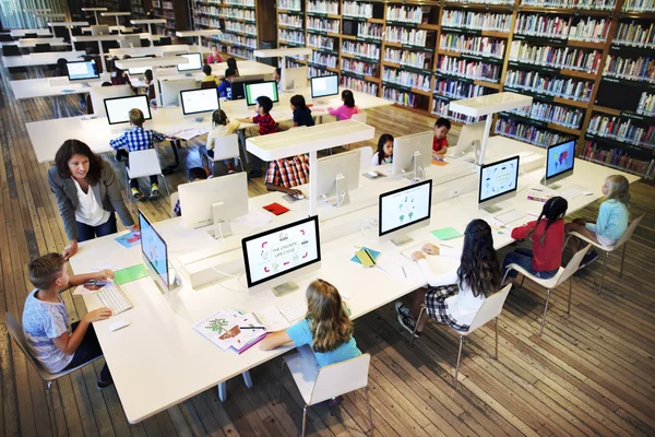 Classmates having lesson with teacher — Stockfoto