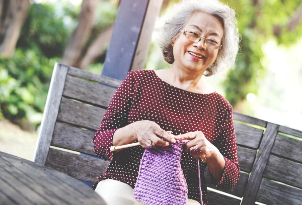 Grandma crocheting Concept — стоковое фото