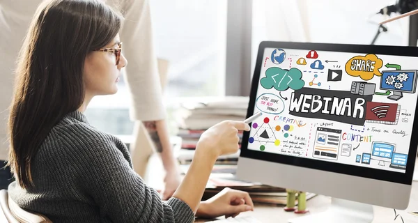 Woman showing on monitor with webinar — Stock Photo, Image