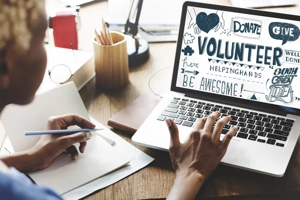 Laptop with text: Volunteer — Stock Photo, Image