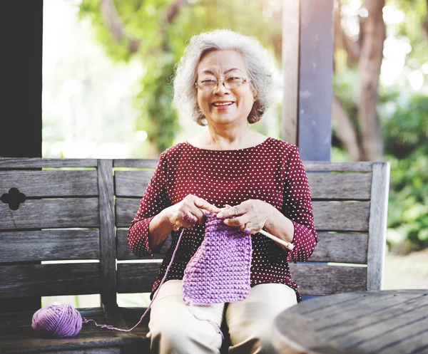 Grandma crocheting Concept — стоковое фото