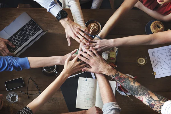 People making pile of hands — Stock Photo, Image