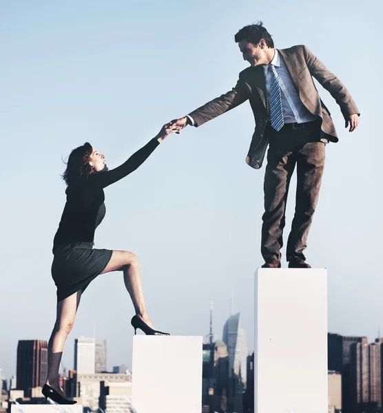 Businessman helping colleague to succeed — Stock Photo, Image