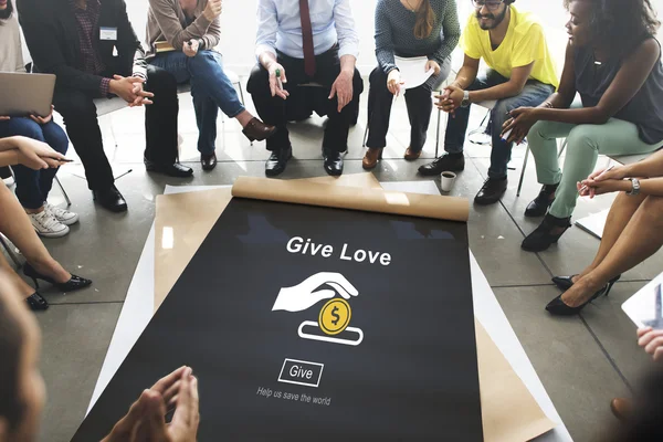 Pessoas sobre cartaz com Give Love — Fotografia de Stock