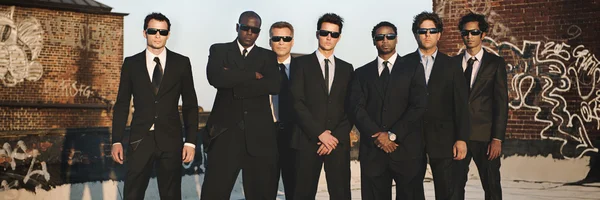 Business-Team i svarta kostymer — Stockfoto