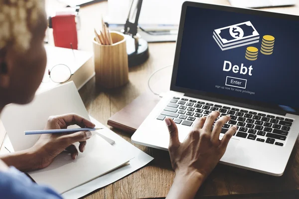 Woman working on laptop with debt — Stock Photo, Image