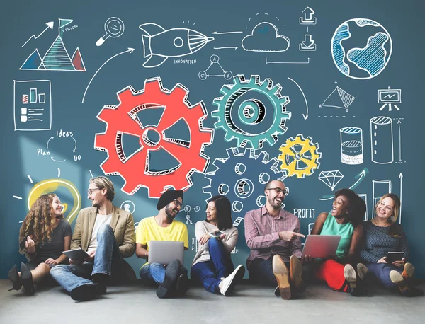 Diversity friends near wall with plan — Stock Photo, Image