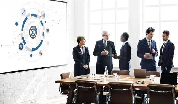 Business people and graphics — Stock Photo, Image