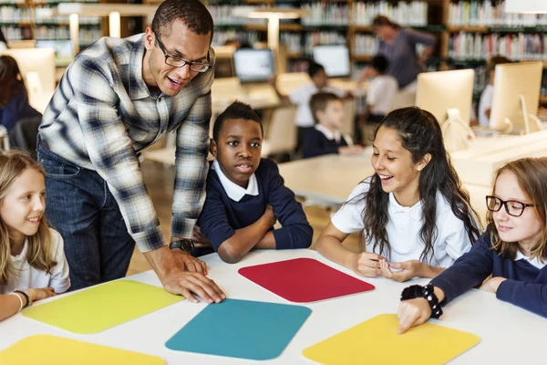 Classmates having lesson with teacher — Stock fotografie