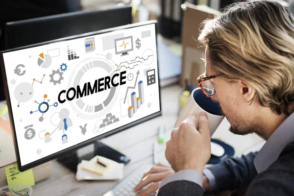 Businessman with commerce on monitor — Stock Photo, Image