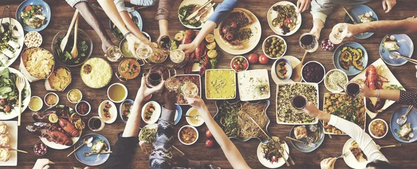 Friends eating for big table — Stock Photo, Image