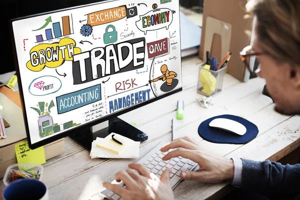 Businessman with trade on monitor — Stock Photo, Image