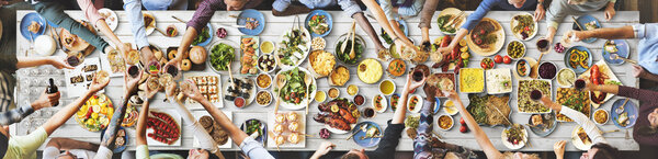 friends eating for big table