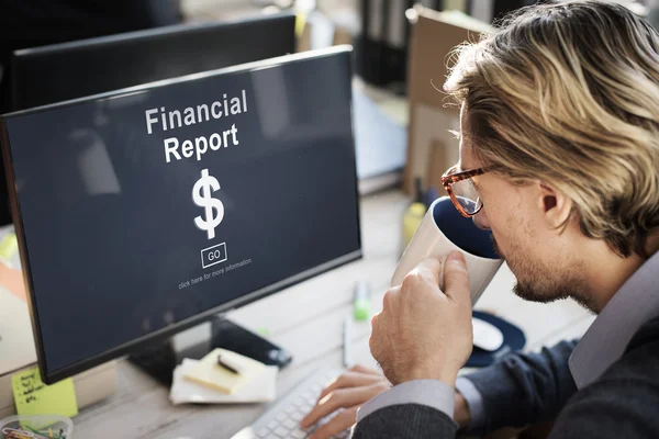 stock image businessman with financial report on monitor