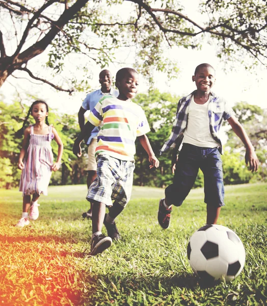 Father playing football with children — Stock Photo, Image