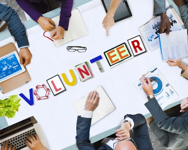 Gente de negocios que señala el concepto de voluntariado — Foto de Stock