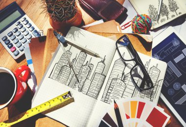 Messy Designer's Table with Sketch and Tools clipart