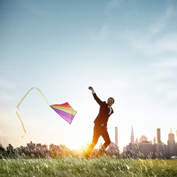 Businessman Playing with Kite — Stock Photo, Image
