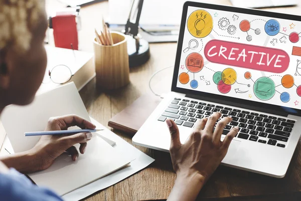 Woman working on laptop with creative — Stock Photo, Image