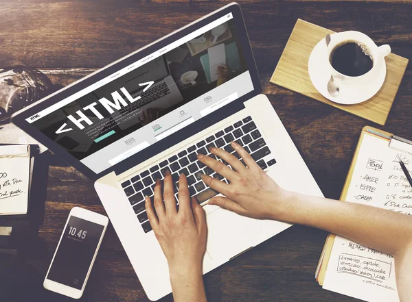 Woman using laptop at her work place — Stock Photo, Image