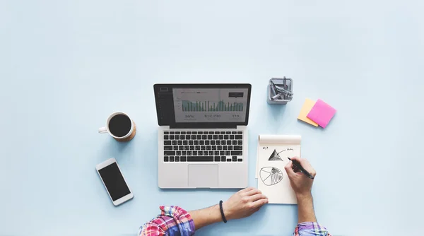 Laptop on table with tools for work — Stock Photo, Image