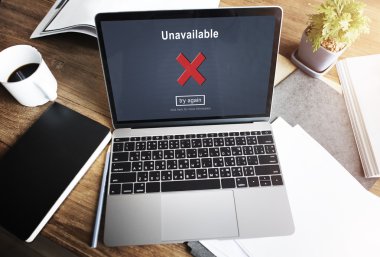 Laptop with unavailable on screen clipart