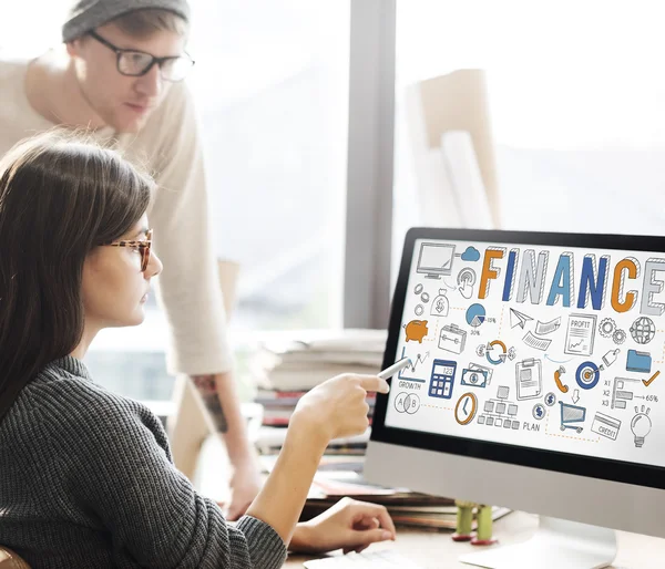 Woman showing on monitor with finance — Stock Photo, Image