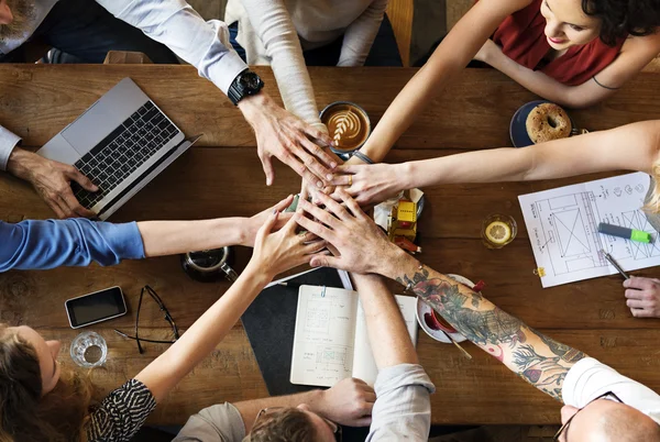 People making pile of hands — Stock Photo, Image