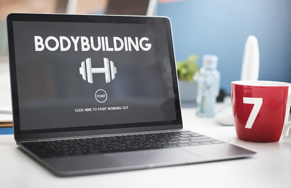 Bodybuilding på skärm laptop — Stockfoto