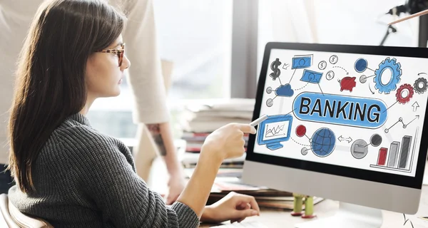 Woman showing on monitor with banking — Stock Photo, Image