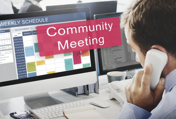 Computer with community meeting on monitor — Stock Photo, Image