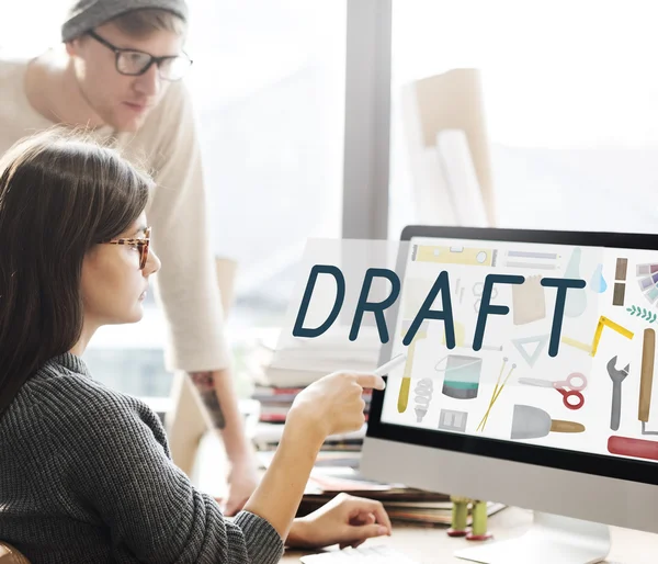 Woman showing on monitor with draft — Stock Photo, Image