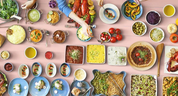 Friends eating for big table — Stock Photo, Image