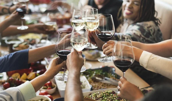 People cheers with glasses — Stock Photo, Image