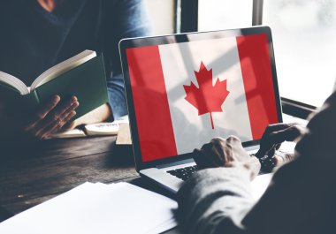 canadian flag on computer monitor clipart