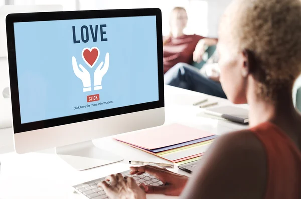 Businesswoman working on computer with love — Stock Photo, Image