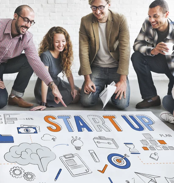 Designers working with poster and startup — Stock Photo, Image