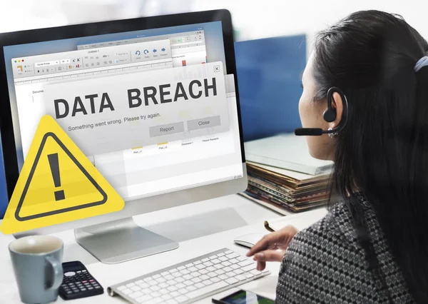 Businesswoman working on computer with Data Breach — Stock Photo, Image