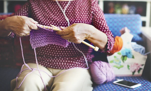 Grandma crocheting Concept — стоковое фото