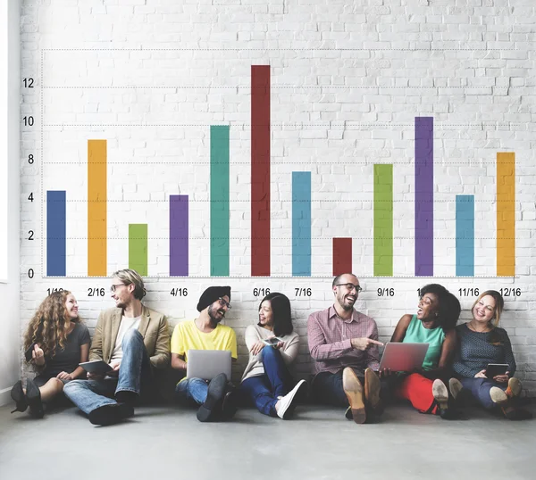 Diversity friends near wall with graph — Stock Photo, Image