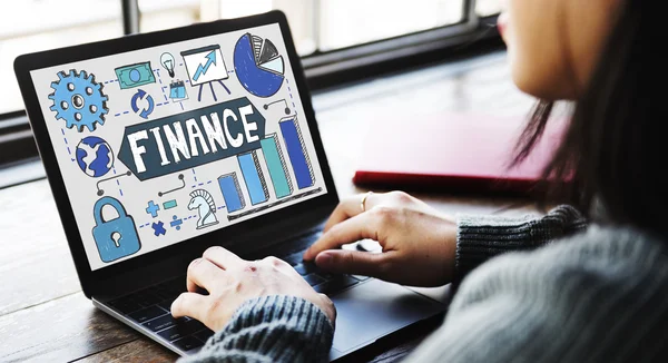 Woman working on laptop with finance — Stock Photo, Image