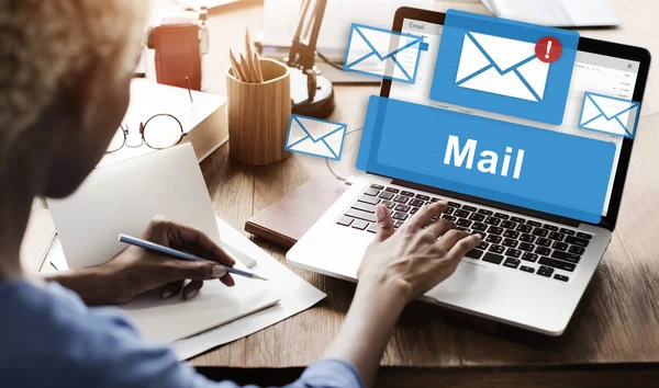 Woman working on laptop with mail — Stock Photo, Image