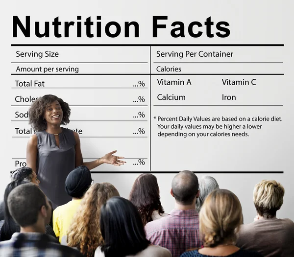 Personas en el seminario con información nutricional — Foto de Stock