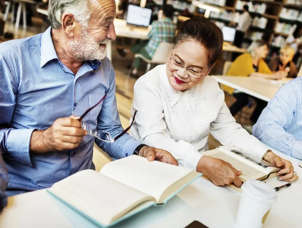Middle aged people studying together — Stock Photo, Image