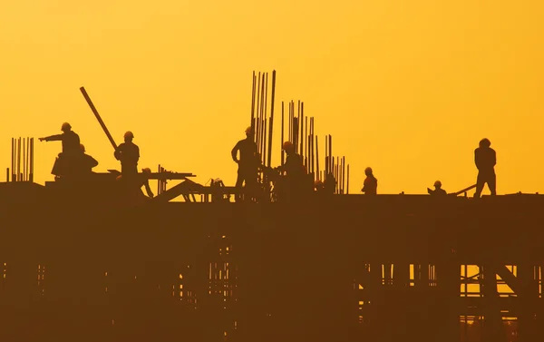 Werknemers in de bouw op Building cite — Stockfoto