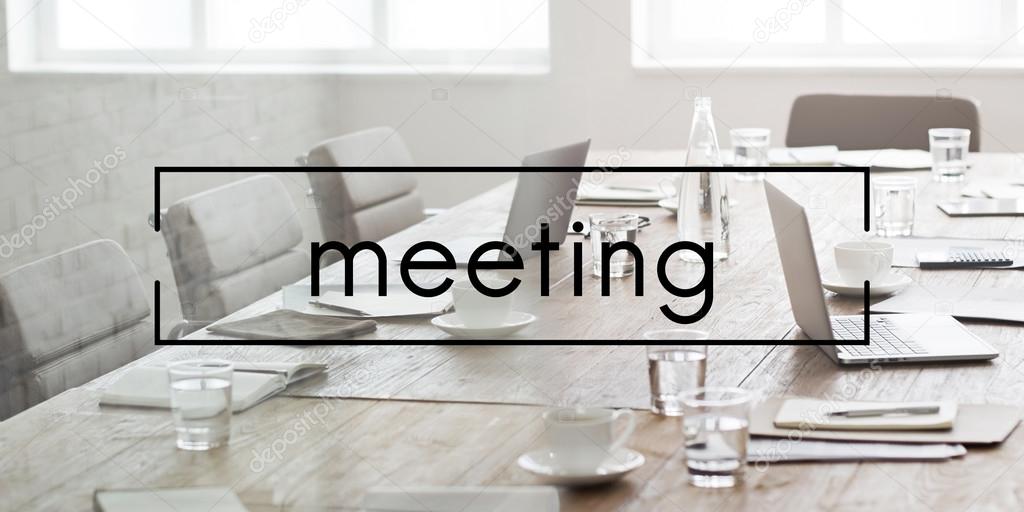 Empty meeting room in office with notebooks, graphic letters concept
