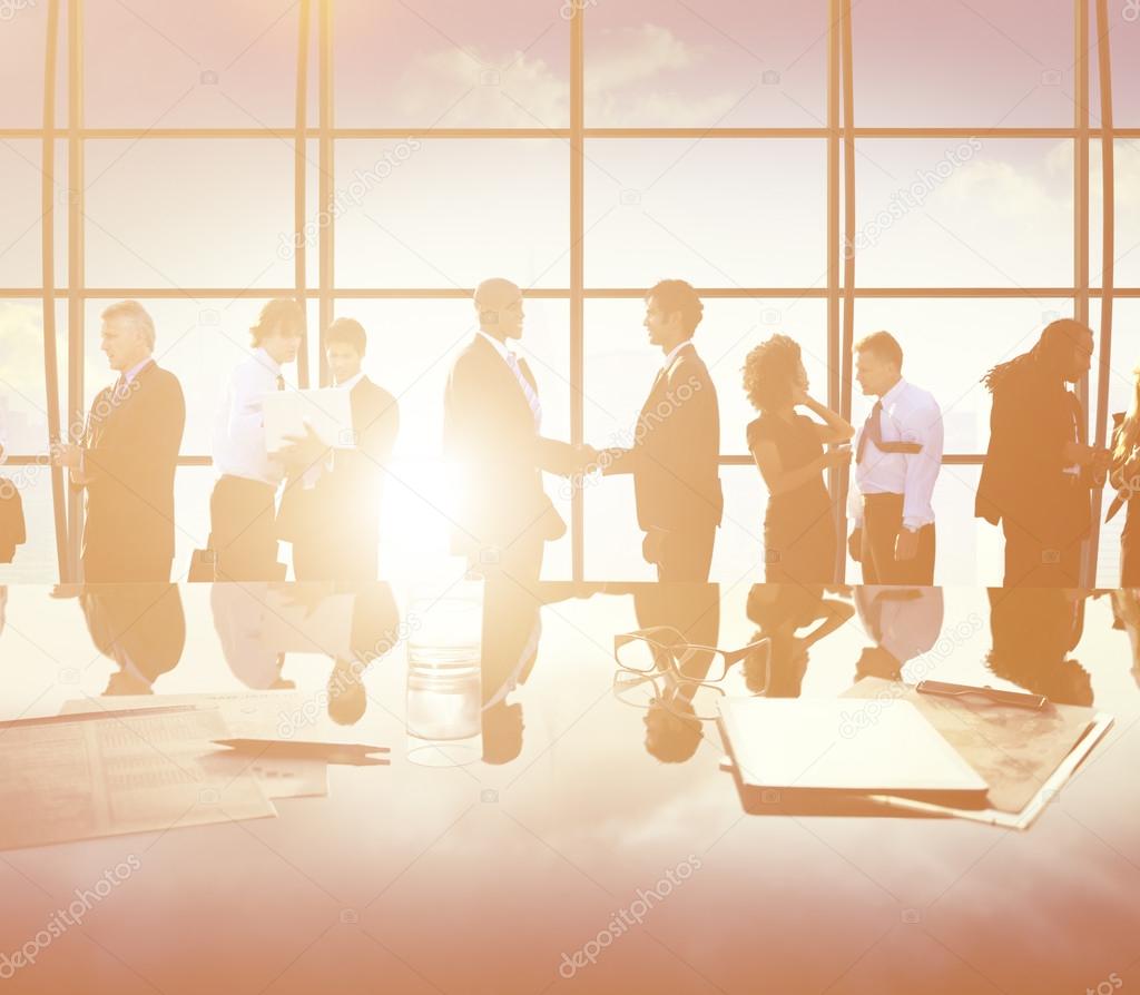 Silhouettes of business people at meeting