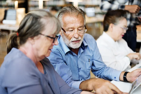 Middle aged people studying — Stock Photo, Image